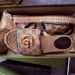 Gucci Tan Espadrille Slides with Gold Emblem